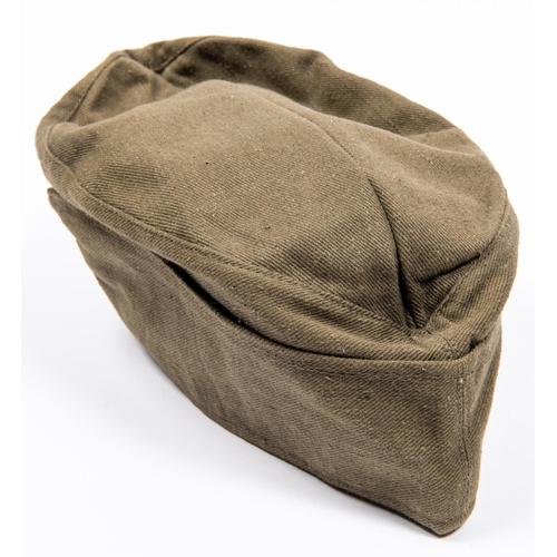 159 - A Third Reich DAK Mans FS cap, olive green  denim with embroidered insignia, dated 1943, GC £400-450