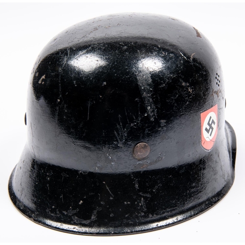 165 - A Third Reich steel police helmet, painted black with replacement decals, lining and chinstrap. GC £... 