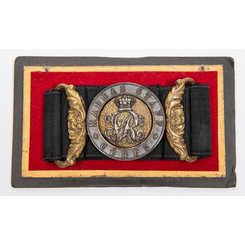 230 - A Victorian officer's waist belt clasp of the Madras Staff Corps. GC, on its black brocade belt. £10... 