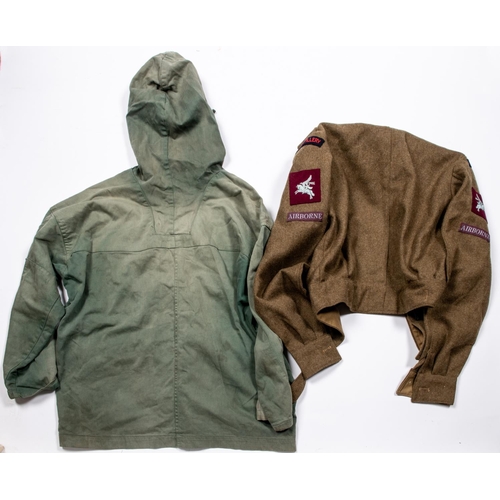 234 - A WWII windproof smock, green colour (faded in patches); a 1949 pattern BD jacket with Airborne insi... 