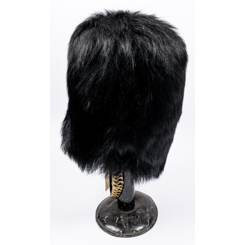 238 - A good officers black bearskin cap of the Scots Guards, c 1900, tapered brass chin chain, cane frame... 