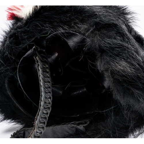 239 - A fine Victorian officer's black bearskin cap of the Northumberland Fusiliers Volunteer battalion, s... 