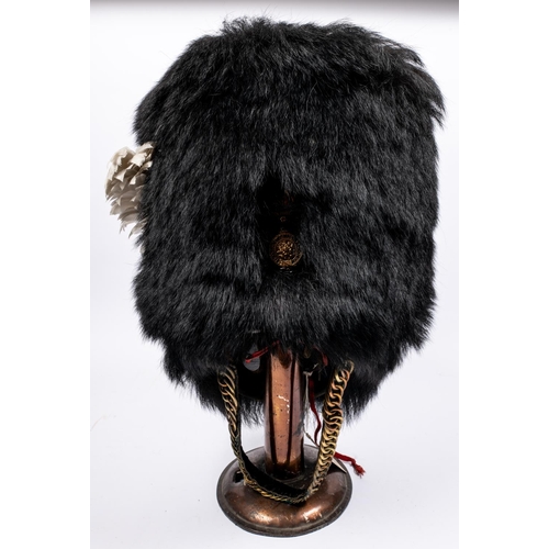 241 - A fine Victorian officer's black bearskin cap of the Royal Fusiliers, gilt, silvered and enamelled g... 