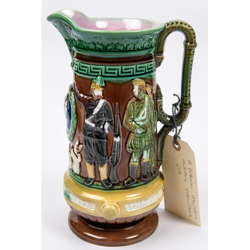 48 - A Victorian majolica jug with military and naval themed embossed figures, height 10½