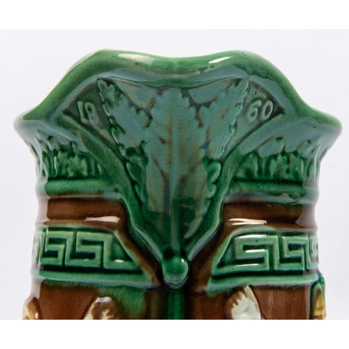 48 - A Victorian majolica jug with military and naval themed embossed figures, height 10½