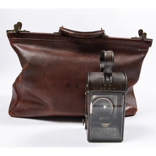 52 - A doctor's large leather bag, with brass lock and catches, the body bearing the initials 