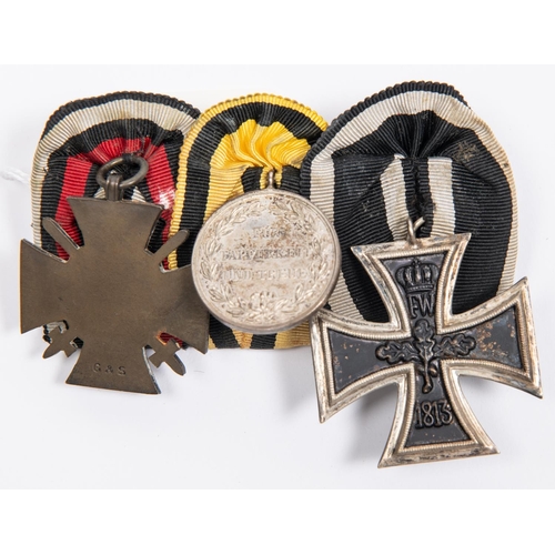 76 - A German WWI medal trio: 1914 Iron Cross 2nd class, Wurttemberg silver Merit medal, and 1914-18 Hono... 