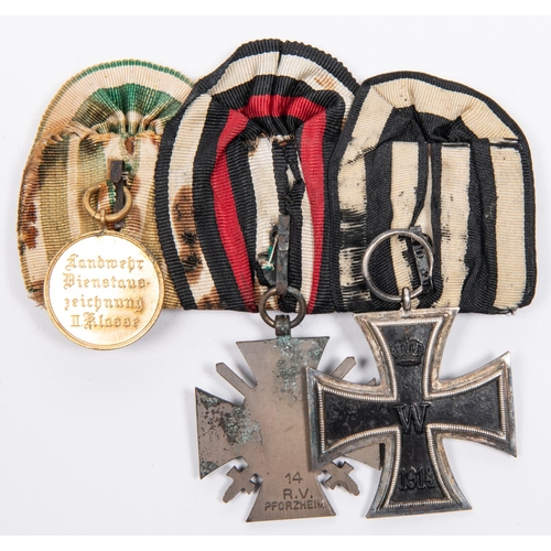 77 - A German WWI medal trio: 1914 Iron Cross 2nd class, 1914-18 Honour Cross, and Reserve Landwehr medal... 