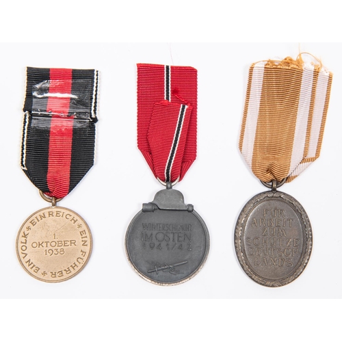 99 - Third Reich medals: Russian Front medal, 1941-42; West Wall medal; and medal for 1st October 1938, w... 