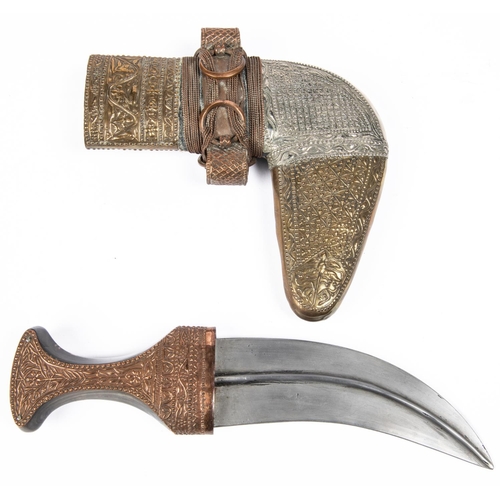 329 - A very good Arab jambiya, watered steel blade 6½”, with panel of overlaid silver Arabic script on on... 