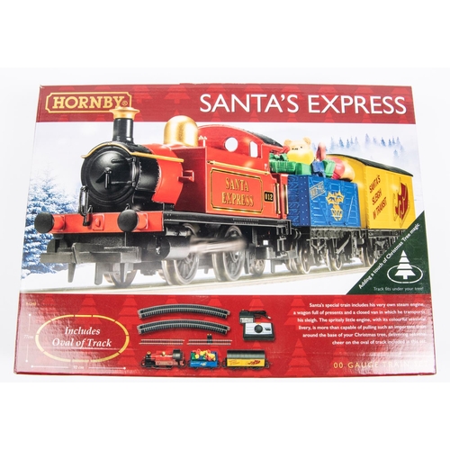 21 - 2 Hornby Hobbies Train Sets. An i Traveller 6000. HM6000 App Based Analogue Control train set. Compr... 