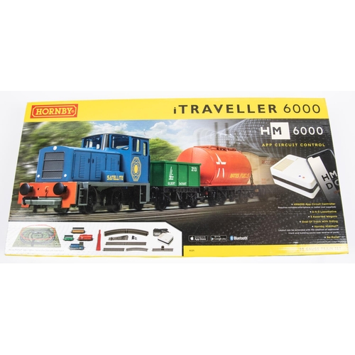 21 - 2 Hornby Hobbies Train Sets. An i Traveller 6000. HM6000 App Based Analogue Control train set. Compr... 