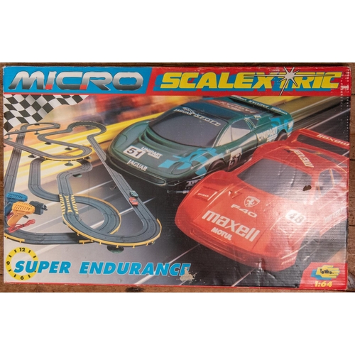 220 - A quantity of Various Makes. Including a Scalextric 'Super Endurance' Jaguar/Ferrari set. 5x Majoret... 