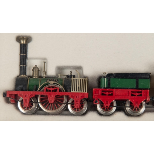 95 - A Trix HO gauge Der Adler train from the 1830s. Comprising a 2-2-2 tender locomotive for 2-rail runn... 