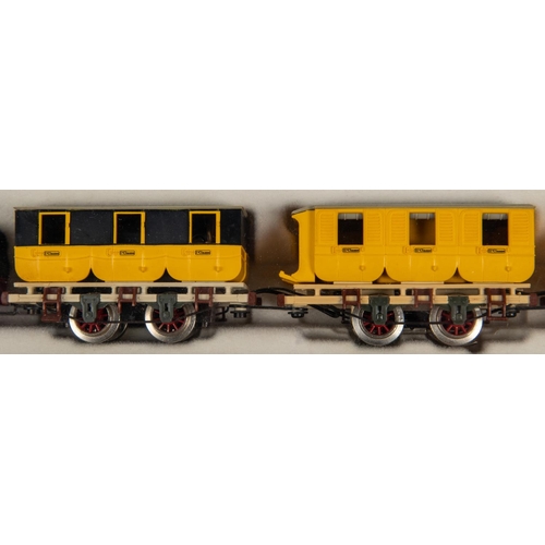 95 - A Trix HO gauge Der Adler train from the 1830s. Comprising a 2-2-2 tender locomotive for 2-rail runn... 