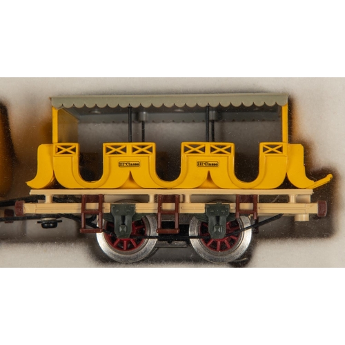 95 - A Trix HO gauge Der Adler train from the 1830s. Comprising a 2-2-2 tender locomotive for 2-rail runn... 