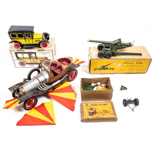 249 - 4x items by various makes. Including; a boxed Britains 155mm Field Gun. A 1950s German made Paradise... 