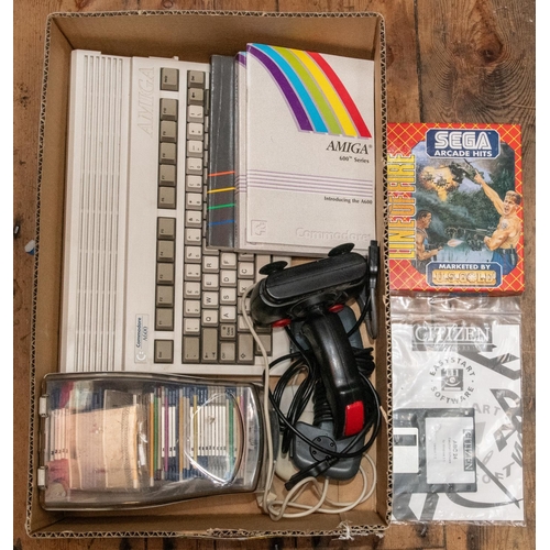 255 - A Commodore Amiga A600 computer with games and accessories. A recently refurbished A600 with mouse, ... 