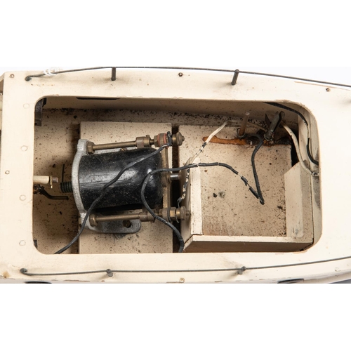 257 - A 1930s Tri-ang Y.C. pond cruiser 'Dido'. Plywood construction with battery driven motor. Hull in bl... 