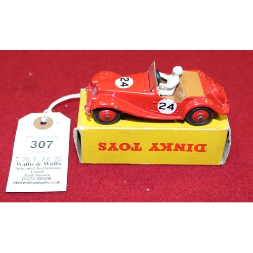 307 - Dinky Toys 108, MG Midget Sports car. In red with tan interior and red wheels, RN24. Boxed, minor we... 