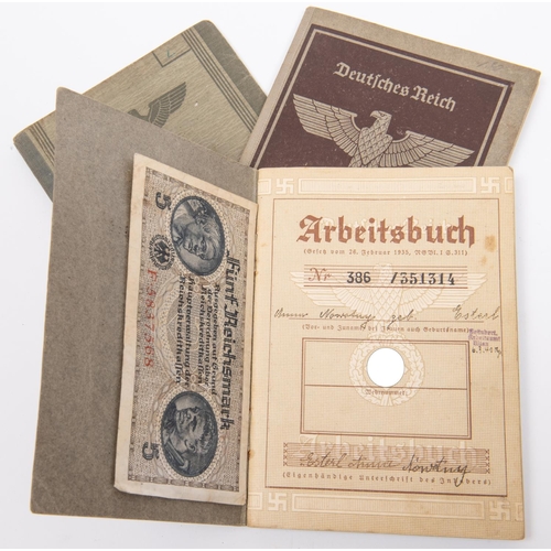 101 - A Third Reich Wehrpass, two similar Arbeitsbuch, and a Dienstausweis. GC £30-50