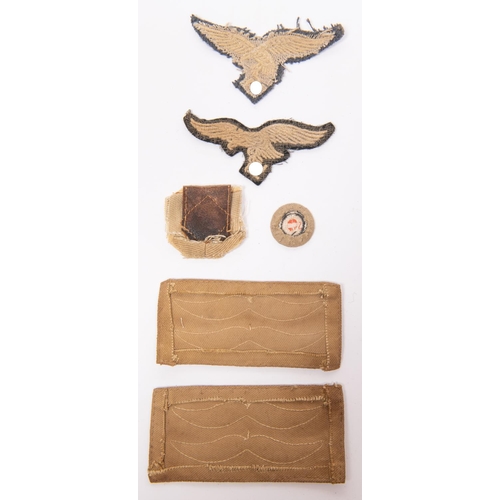 108 - Third Reich cloth items: two Luftwaffe embroidered breast eagles; two felt rank emblems from Luftwaf... 