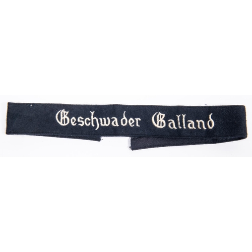 114 - A black felt armband, embroidered in white Geschwader Gelland