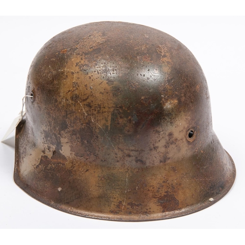 155 - The skull only of a German M42 steel helmet, with traces of camouflage finish and single mostly obli... 