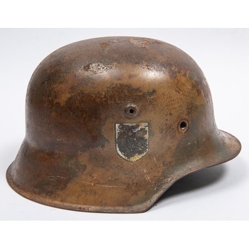 155 - The skull only of a German M42 steel helmet, with traces of camouflage finish and single mostly obli... 