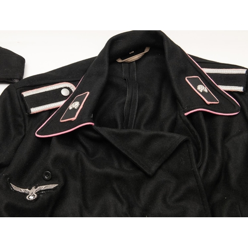 173 - A good quality copy of a Panzer Mans black uniform, comprising field cap, pink piped blouse and pair... 