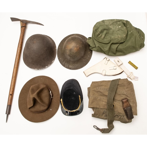 208 - A military Alpenstock, 2 kit bags, a white revolver holster, 2 bayonet frogs, 2 steel helmets (no li... 