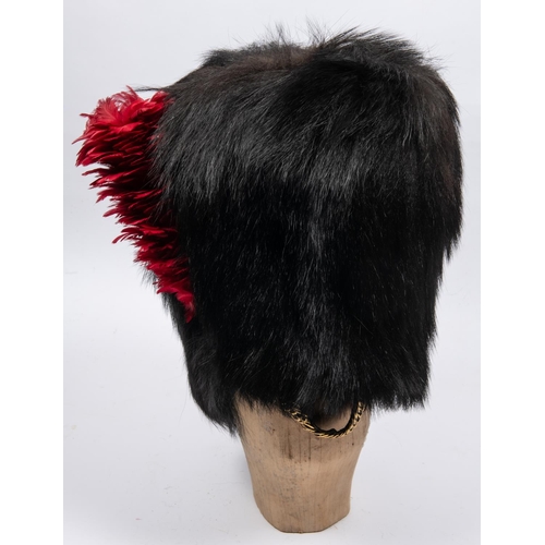 287 - A fine Victorian officer's black bearskin cap of the Coldstream Guards, cane frame, black leather li... 