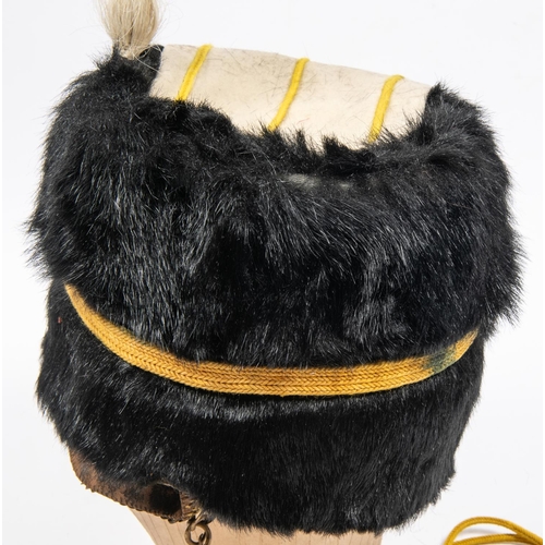 296 - A good example of an ORs busby of the 19th Hussars, dated 1911, black fur with white bag, white plum... 