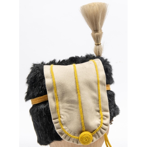 296 - A good example of an ORs busby of the 19th Hussars, dated 1911, black fur with white bag, white plum... 