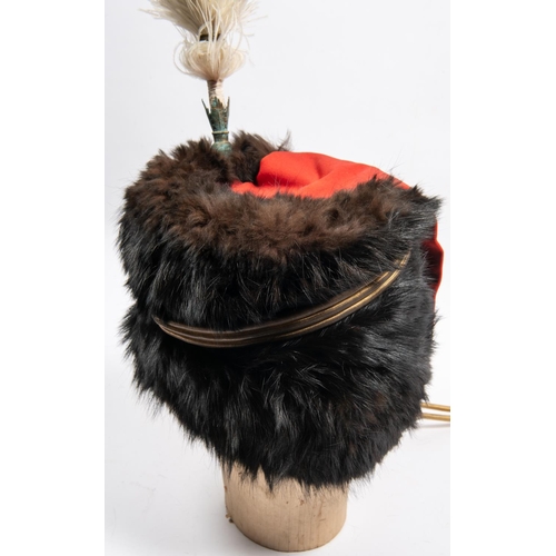 299 - An officer's sable busby of the Royal Horse Artillery, red bag, tall white feather plume in gilt hol... 