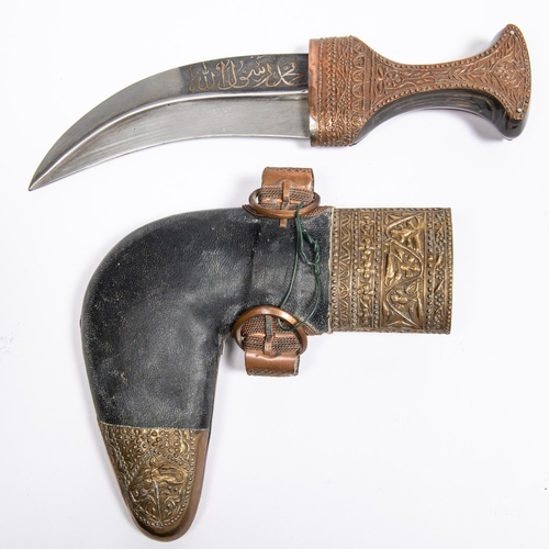 329 - A very good Arab jambiya, watered steel blade 6½”, with panel of overlaid silver Arabic script on on... 