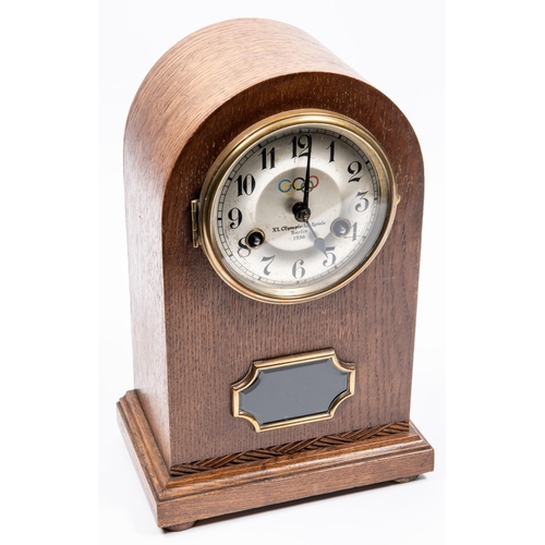 85 - A Third Reich oak mantle clock, the face marked 