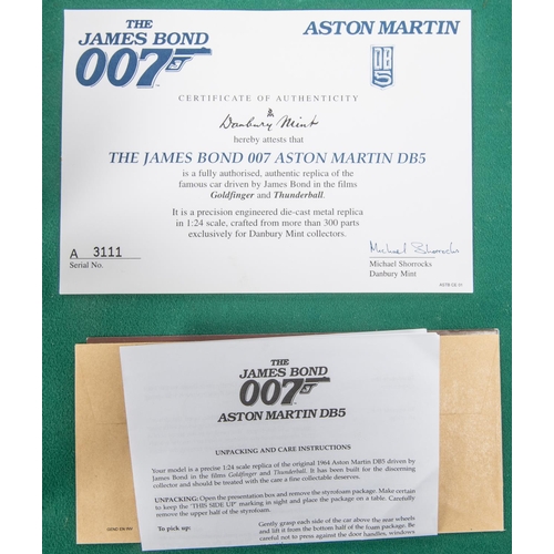 153 - Danbury Mint James bond Aston Martin DB5 ( silver issue). Comes complete with Certificate and paperw... 