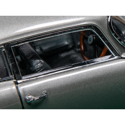 154 - Danbury Mint James Bond Aston Martin DB5 (Silver issue). Comes complete with certificate and paperwo... 