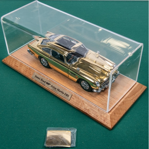 155 - Danbury Mint James Bond Aston Martin ( Gold issue). Comes complete with Certficate and paperwork, Al... 