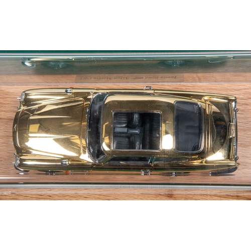 155 - Danbury Mint James Bond Aston Martin ( Gold issue). Comes complete with Certficate and paperwork, Al... 