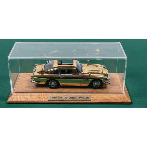 155 - Danbury Mint James Bond Aston Martin ( Gold issue). Comes complete with Certficate and paperwork, Al... 