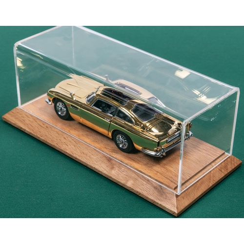 155 - Danbury Mint James Bond Aston Martin ( Gold issue). Comes complete with Certficate and paperwork, Al... 