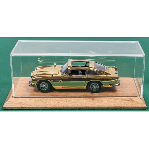 155 - Danbury Mint James Bond Aston Martin ( Gold issue). Comes complete with Certficate and paperwork, Al... 