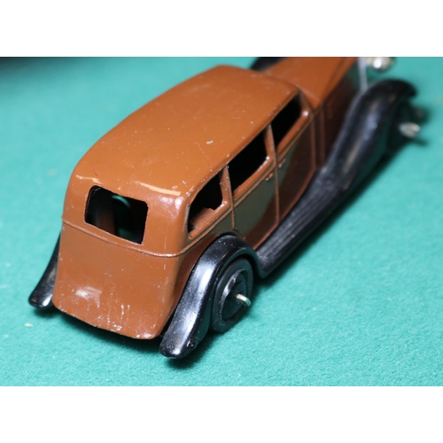 253 - Dinky Toys Vauxhall Car (30d). A 1946-1950 example in dark brown with black closed chassis, black ri... 