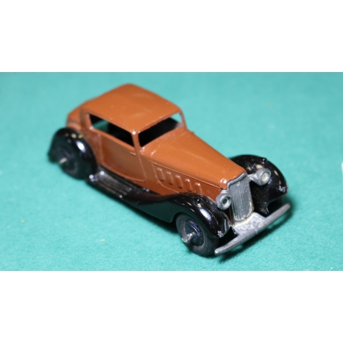 257 - Dinky Toys Humber Vogue (36c). A Post War example in dark brown with black moulded chassis, black ri... 