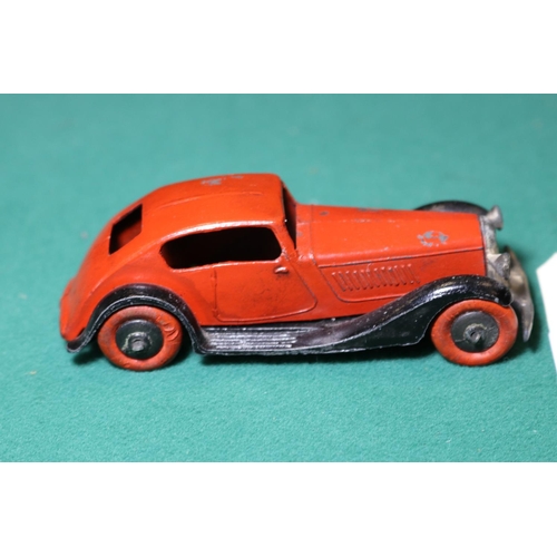 265 - Dinky Toys 24 Series Super Streamlined Saloon 24e. An example in red with black 'criss-cross chassis... 