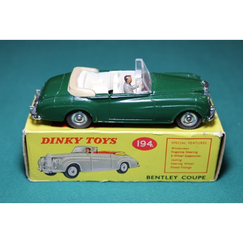 282 - Dinky Toys Bentley Coupe (194). A rare, possibly unique example in dark green with cream interior wi... 