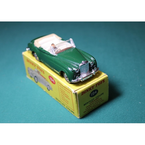 282 - Dinky Toys Bentley Coupe (194). A rare, possibly unique example in dark green with cream interior wi... 