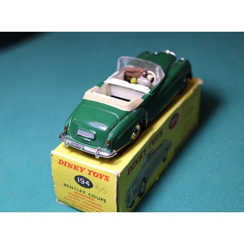 282 - Dinky Toys Bentley Coupe (194). A rare, possibly unique example in dark green with cream interior wi... 